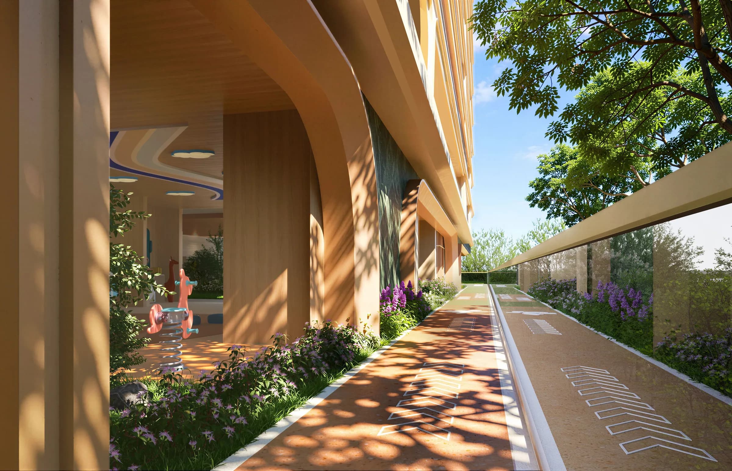 A curving jogging track beside planted beds and a covered walkway